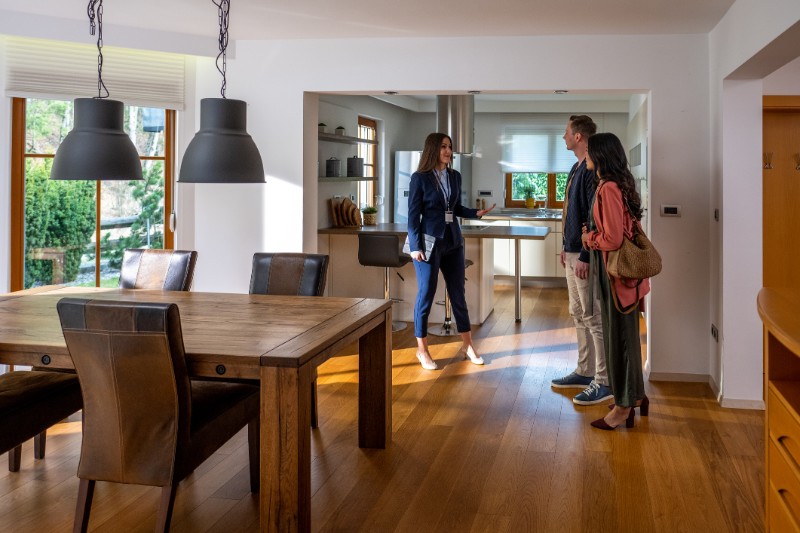 state agent talking with couple