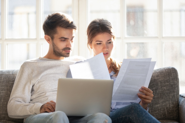 couple reading documents